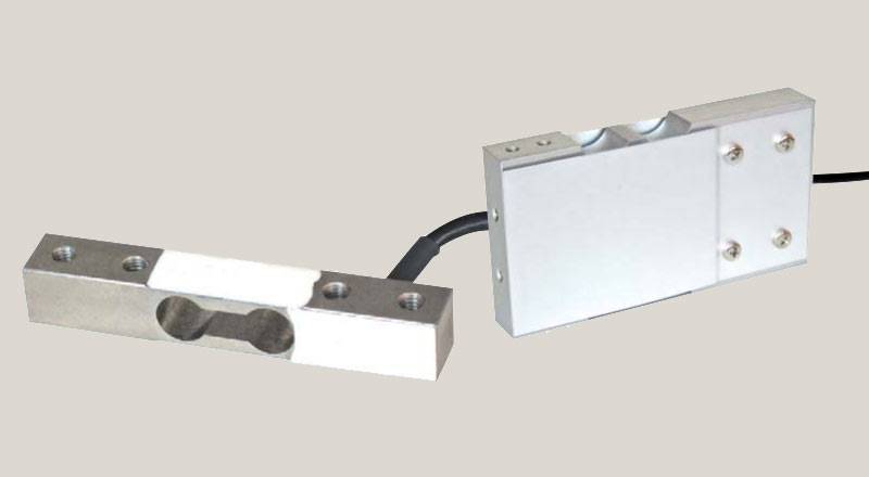 Celle di carico off-center